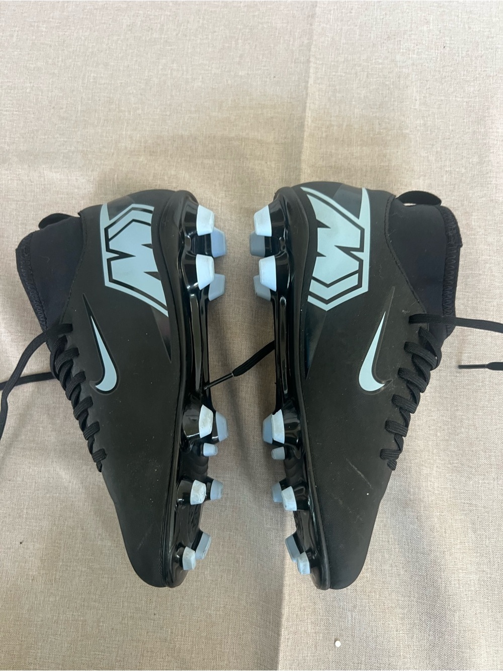 Nike Kids Black Soccer Cleats with Light Blue Accents
